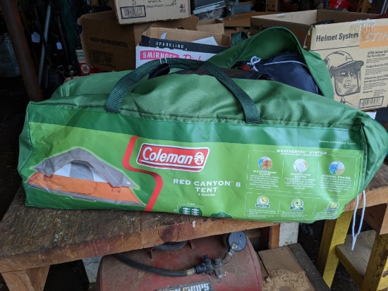 Coleman Red Canyon 8 person tent with 3 rooms. The tent and bag both appear to be in good condition