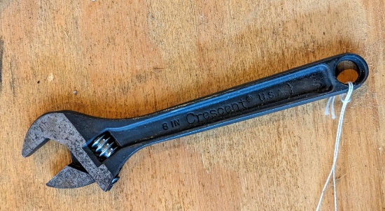 8" Crescent wrench. The wrench is in good shape and shows signs of old rust.