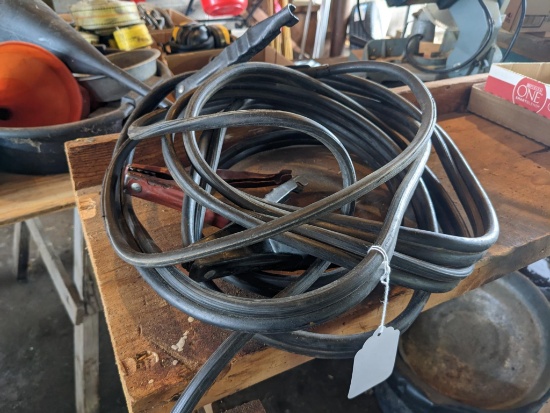 Heavy duty jumper cables, approx 20'. Overall good clamps, one is twisted but still functional