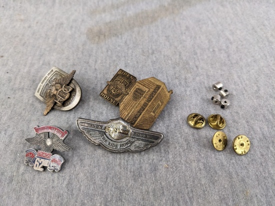 Three Harley Davidson pins, plus a 2002 Sturgis pin. Largest pin is 2-1/8" wide.