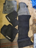 5 floormats possibly for a 2019 Crew Cab RAM 1500, two of which are hard rubber Weathertech front
