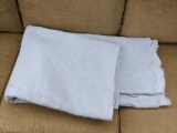 Queen size matelasse bed cover is a pretty light blue color. Piece is in overall good condition with
