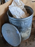 Galvanized can with lid holds one pretty much full and one partial bag of corn. Stands 26