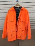 Red Head Bion II size XL blaze orange hunting coat has a reversible lining.