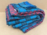 Plaid comforter comes with one lower and two top pillow cases. Measures approx 6' x 7'. In good