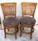 Set of 2 swiveling chairs sold by Hung Fung Woods Co.; each measures 19
