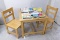 Child's hardwood table and chair set. Table is approx 2'x2'.
