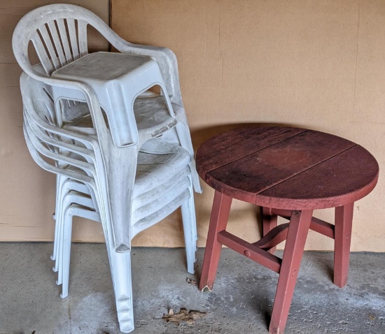 Four resin yard chairs, plus a patio table and a step stool. Patio table measures 27" diameter x 2'