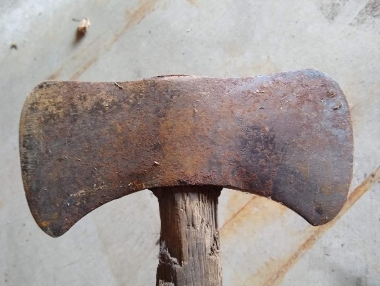 Double bit axe has a 10" head and tight on a 34" handle.