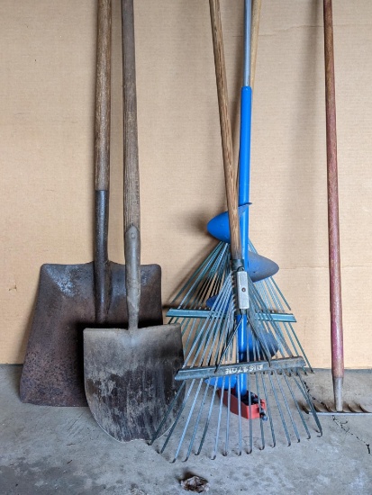 Garden tools and hand ice auger. Yard & garden tools include two leaf rakes, 6" wide hand rake, flat