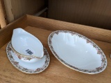 Limoges Florale pattern china bowl and gravy boat were made in France. Very small chipping noted on
