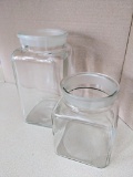 Two glass canisters have ground necks. Tallest is approx. 9-1/2