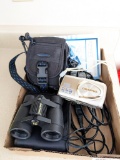 Olympus Stylus Digital camera with case, charger, and papers; plus a pair of 4x30 Bushnell Powerview