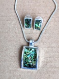 Pretty green and silver toned necklace and earring set is in good condition. Necklace about 10