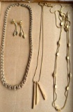 Three gold toned necklaces and a pair of 1-3/4