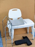 Deluxe adjustable height bath seat; back support, floor standing towel rack, more. Bath seat is