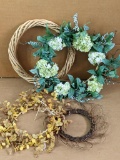 Four seasonal wreaths are in good condition. Largest has hydrangeas and measures approx. 2' across.