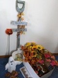 Autumn yard and garden including faux sunflowers, garden stakes, lighted ghost, hand painted shovel