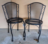 Two steel patio chairs in pretty good condition with a little bit of flaking paint. Stand approx