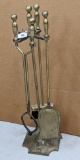 Brass toned fireplace set includes brush, tongs and shovel, stands 33