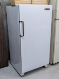 Located in basement, please bring help to remove. Gibson Budget Master upright freezer, model