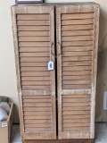 Solid pine cabinet with louvered doors is 24