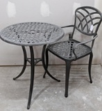 Charming patio table and chair. Both in good condition. Table about 25