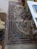 8' x 5-1/2' area rug is in overall good condition