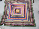 Colorful child's afghan measures about around 4' x 4'. In good condition.