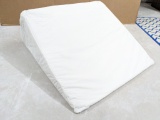 Wedge pillow in good condition measures 2' long.
