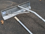 Lightweight aluminum snow rake has a two piece handle for easy storage. About 12' total.