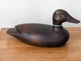 Smooth wooden duck has a tag marked The Glass Candle. In good condition, about 12
