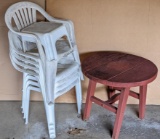 Four resin yard chairs, plus a patio table and a step stool. Patio table measures 27