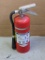 Amerex 5 pound fire extinguisher with flex nozzle. Gauge says its charged.