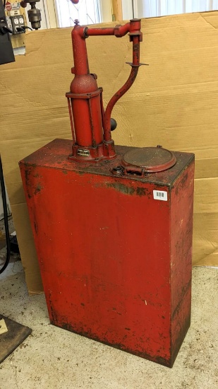 Vintage Bennett hand crank oil pump and reservoir was once used to fill glass oil bottles in a