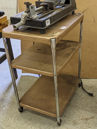 Rolling stand with shelves measures about 16" x 22" x 29".