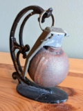 Inert US Military grenade on a cast iron desk stand.