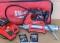 Milwaukee battery powdered grease gun with carry case, an extra battery, charger, Milwaukee soft