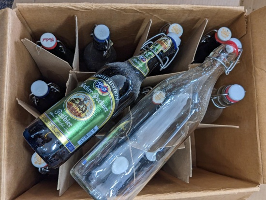 12 wine or beer bottles with lids for home brewing. Largest about 12-3/4". More in lot 145.