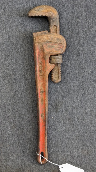 Ridgid 18" pipe wrench w/ good jaws, and a slight bend in the handle.