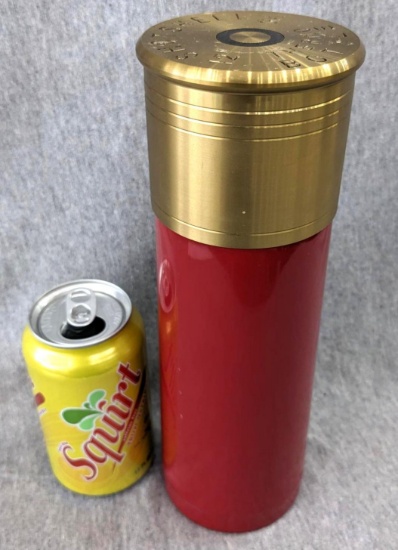 12 gauge shot shell style thermos has all caps, and is in good condition. Really neat bottle.