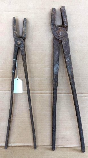 Two pairs of forging tongs, larger is 24" long overall, has rounded jaws and heavy duty handles
