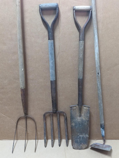 Tree planting shovel, hoe, pitchfork, and a garden fork. Longest about 5'. Shovel has a slight