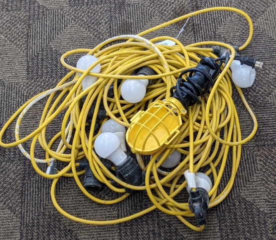 Temporary work light string and a smaller work light. Works and is about 85' long. Tag is marked