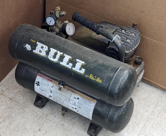 Rol-Air Bull dual-tank air compressor model MK-246, compressor runs and is missing a gauge cover.