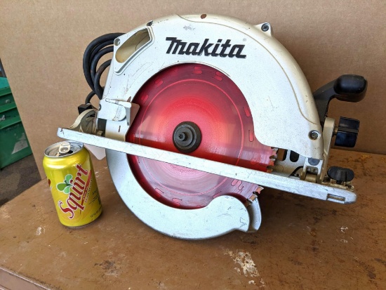 Mikita 10" circular saw model no. 5104. The saw is in overall good condition with the rip guide, and