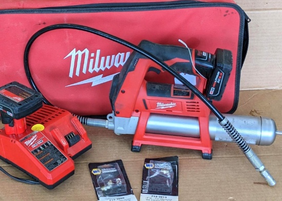 Milwaukee battery powdered grease gun with carry case, an extra battery, charger, Milwaukee soft