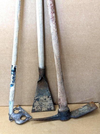 Mason or concrete hoe, 7" wide chisel or floor scraper, and a pickaxe.