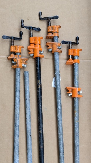 Four Pony clamps, longest measures approx 5' tall, and all appear in good condition.