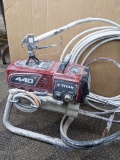 Titan Impact 440 paint sprayer comes with extra Titan reversible tips/seals and approx 45' of hose.